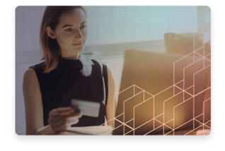 Woman sitting at a computer.